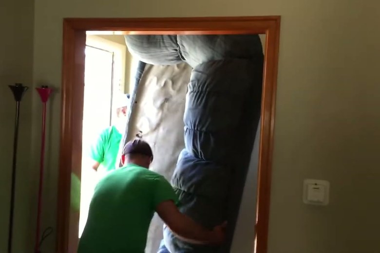 Easing a mattress through a doorway